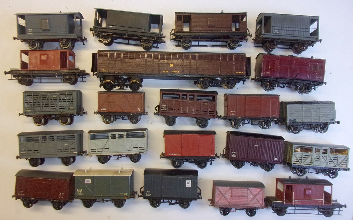22 x 0 GAUGE 3 RAIL ASSORTED WAGONS, various makes. Quite an array of brake vans included. Good used condition.