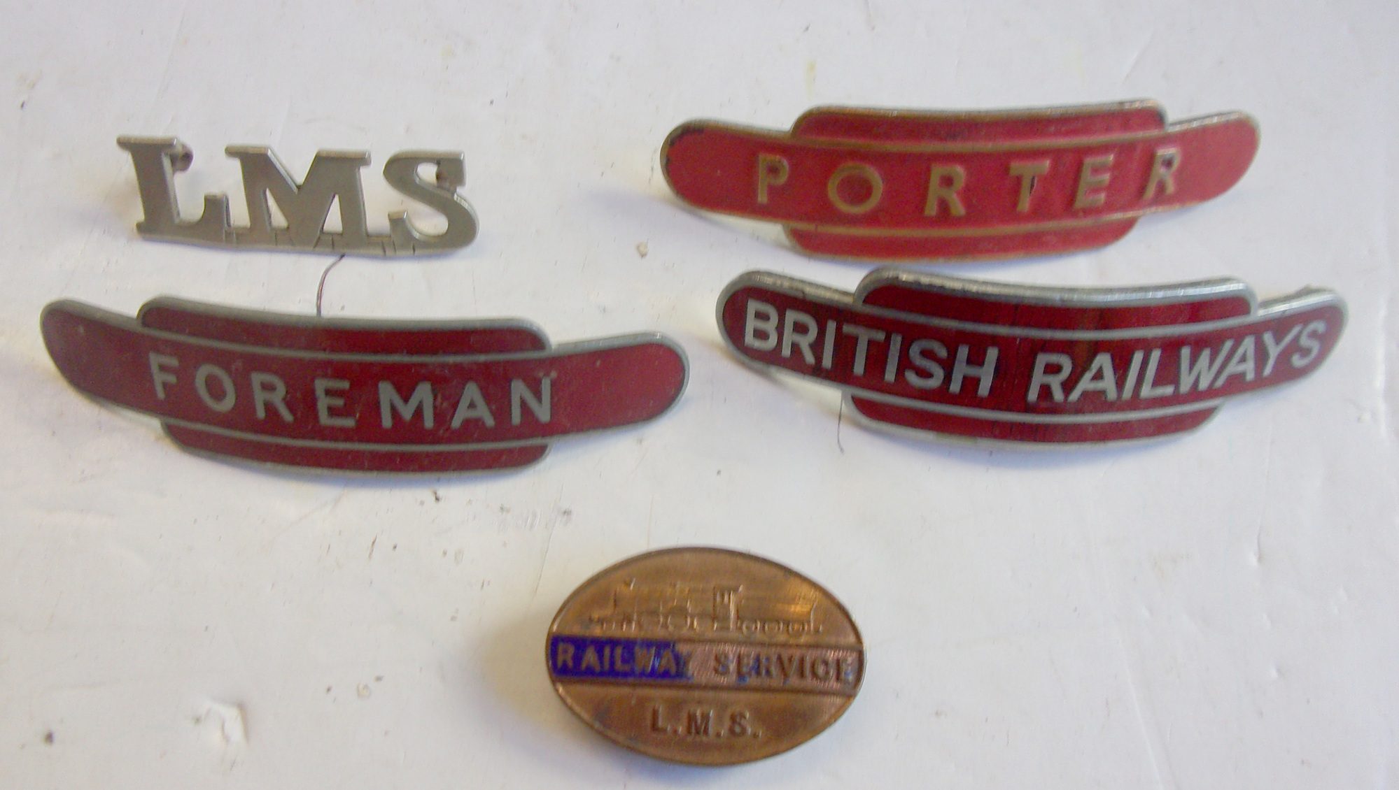 Small group of badges, as pictured.