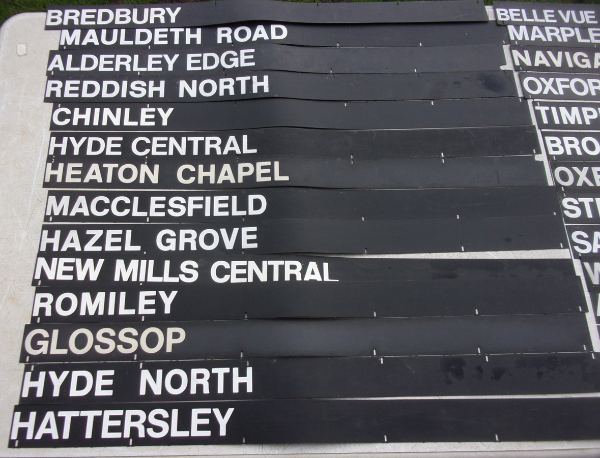 Quantity of Train Destination Labels, from Station Time Table Machine on flexible plastic. 30" x 2 1/2".  v.g.c.