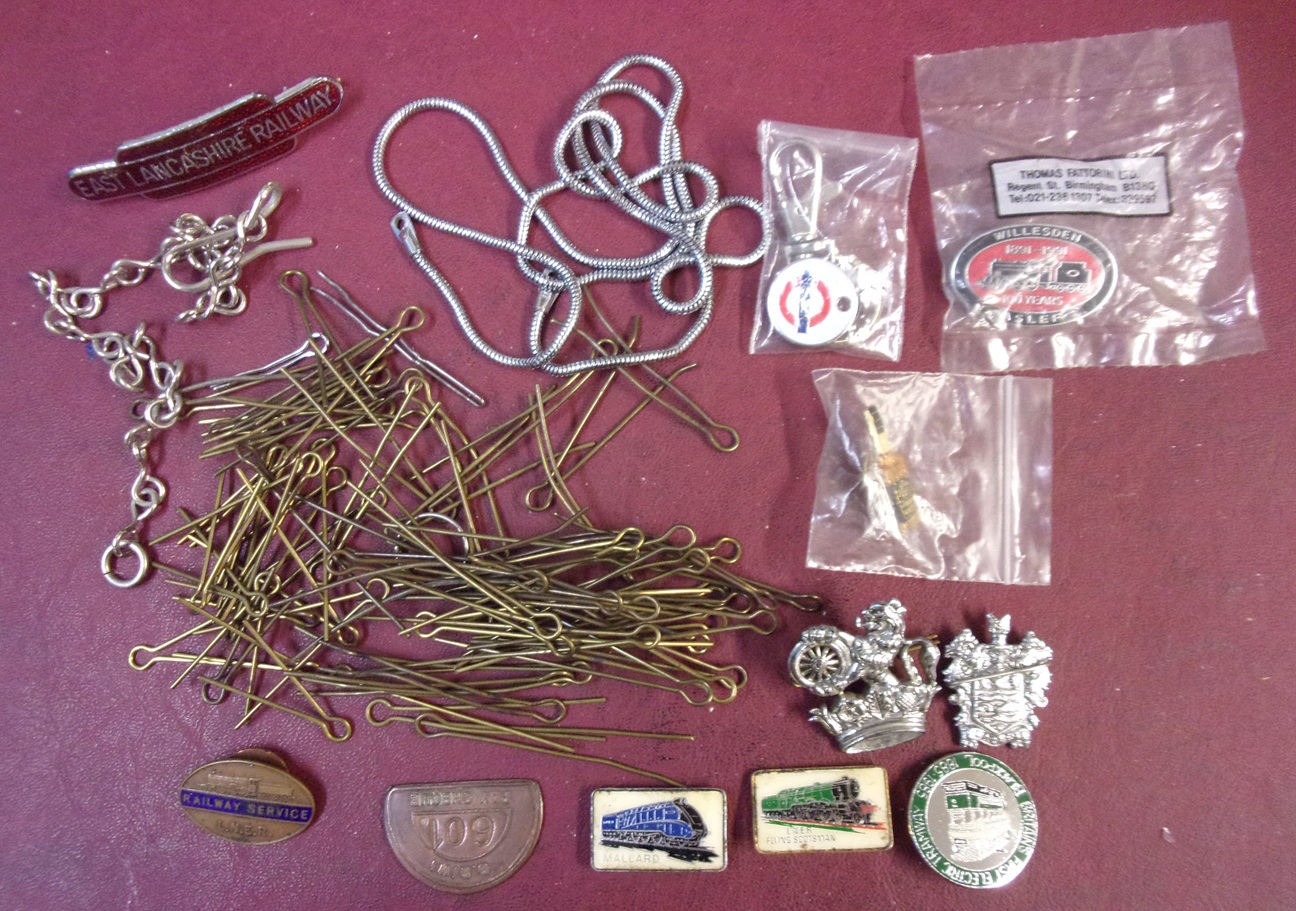 Quantity of cap badge clips, as well as odds & ends.