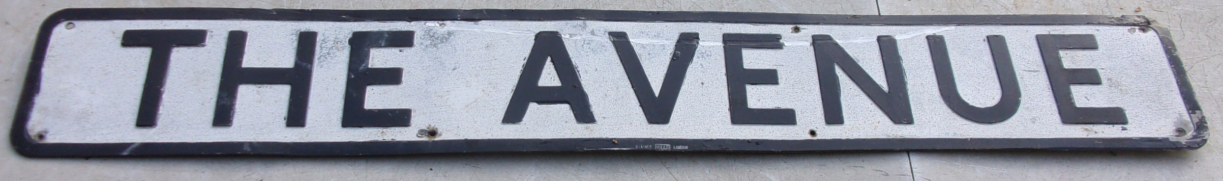 Street Name "The Avenue" in pressed aluminium.  42" x 6".