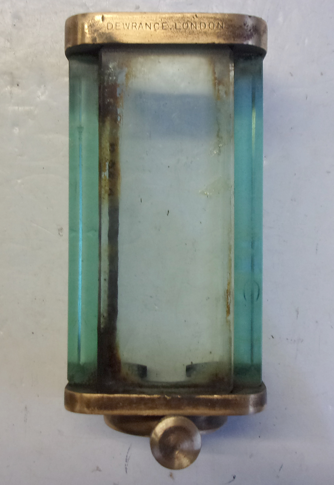 Loco Water Gauge Cover, incomplete.  Stamped "DEWRANCE LONDON".  7" x 3 1/4"