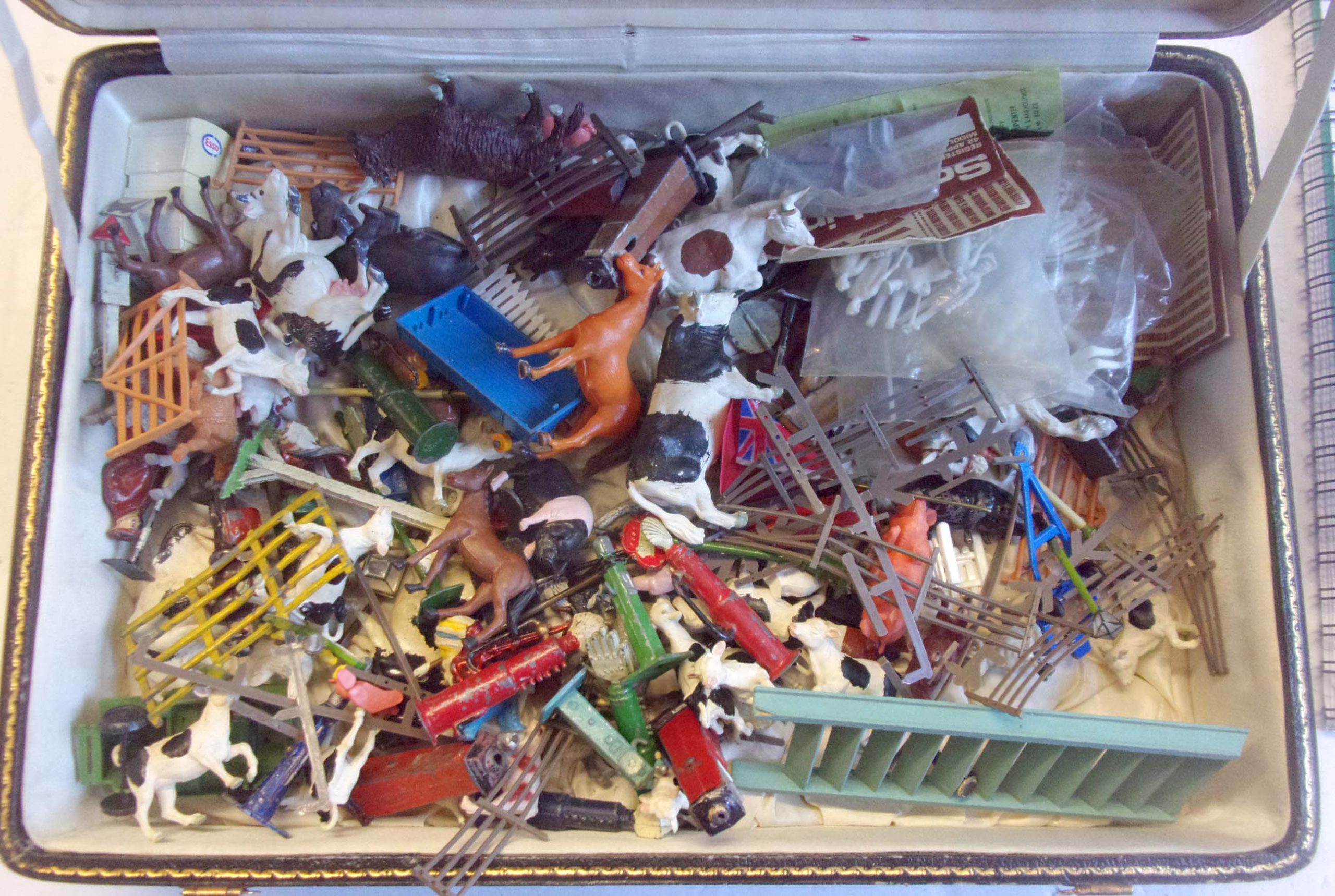 A delve of O gauge farm animals, petrol pumps etc etc. As pictured.