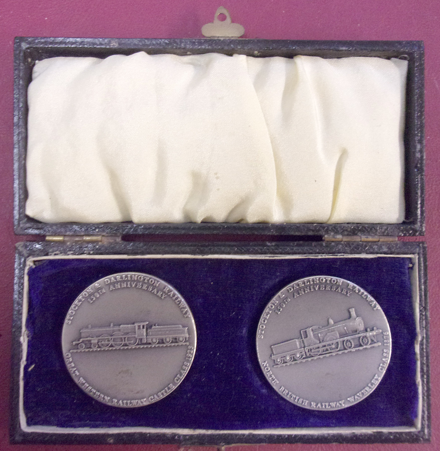 2 x Hallmarked Silver Medallions "Stockton & Darlington Railway 15th Anniversary "North British" & "GWR", as pictured in case. Medallion, 1 1/2" diameter, 1/8" thick, (2 x images to view)