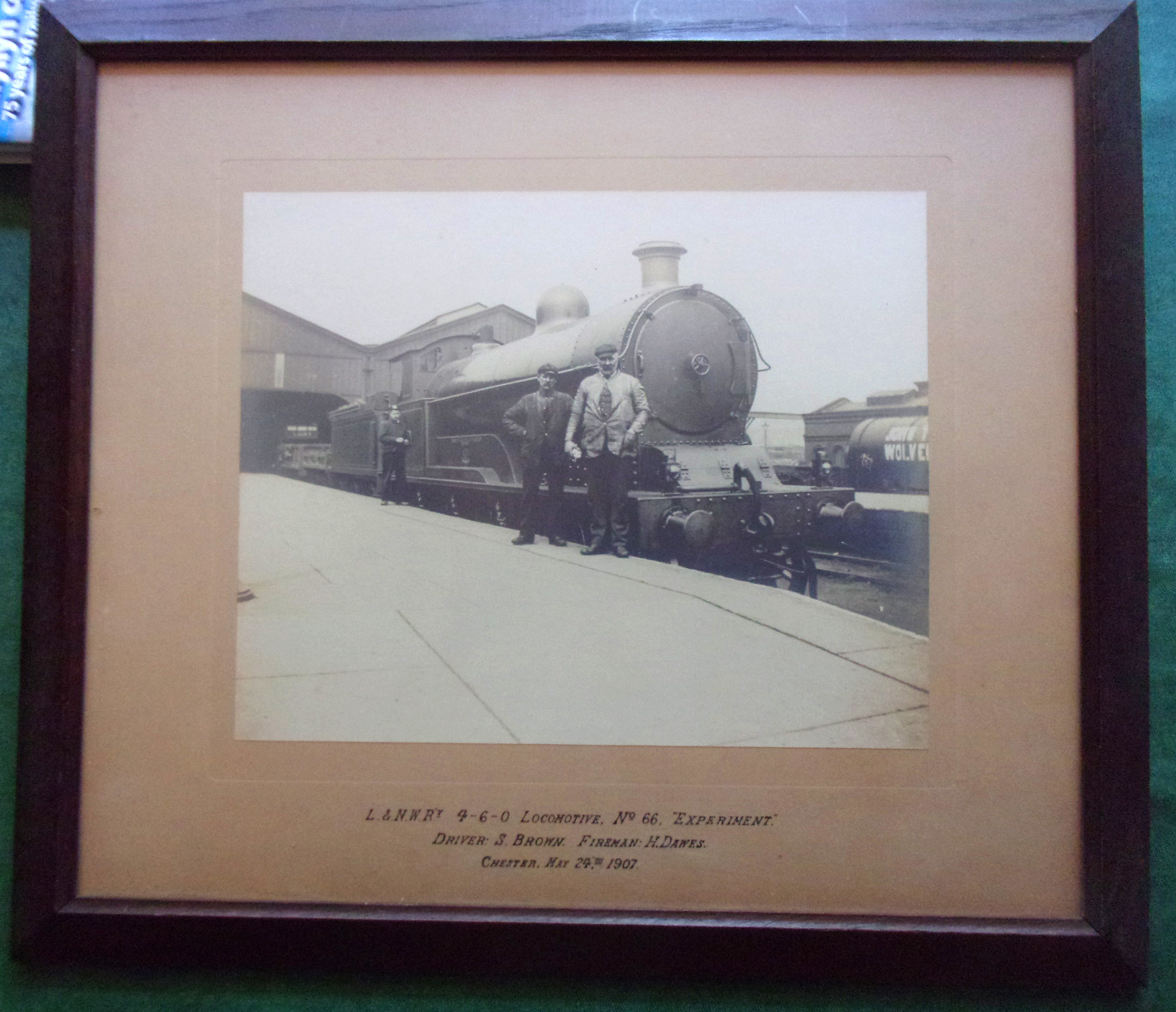 B&W photo print of L&NWRY 4-6-0 Loco No. 66 Experiment with its crew driver S. Brown, Fireman H. Dawes at Chester May 24th 1907. Image 12" x 10". Framed & glazed. Old frame.