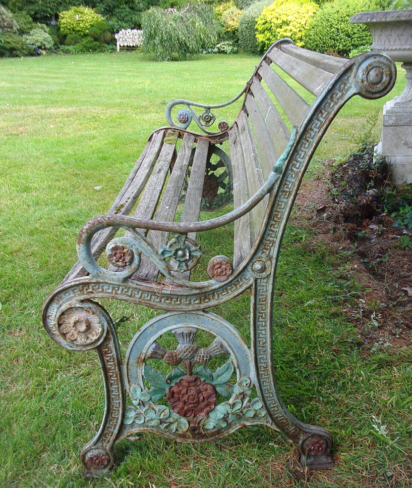 Station Seat, cast iron ends with timber slatted seat, very ornate. Not sure if railway related, has Tudor Rose & Scottish Thistle decoration, perhaps LMS. 62" long, 35" high. Sold in situ, Poynton area of Cheshire. Timbers will need some attention. Cast iron, sound.