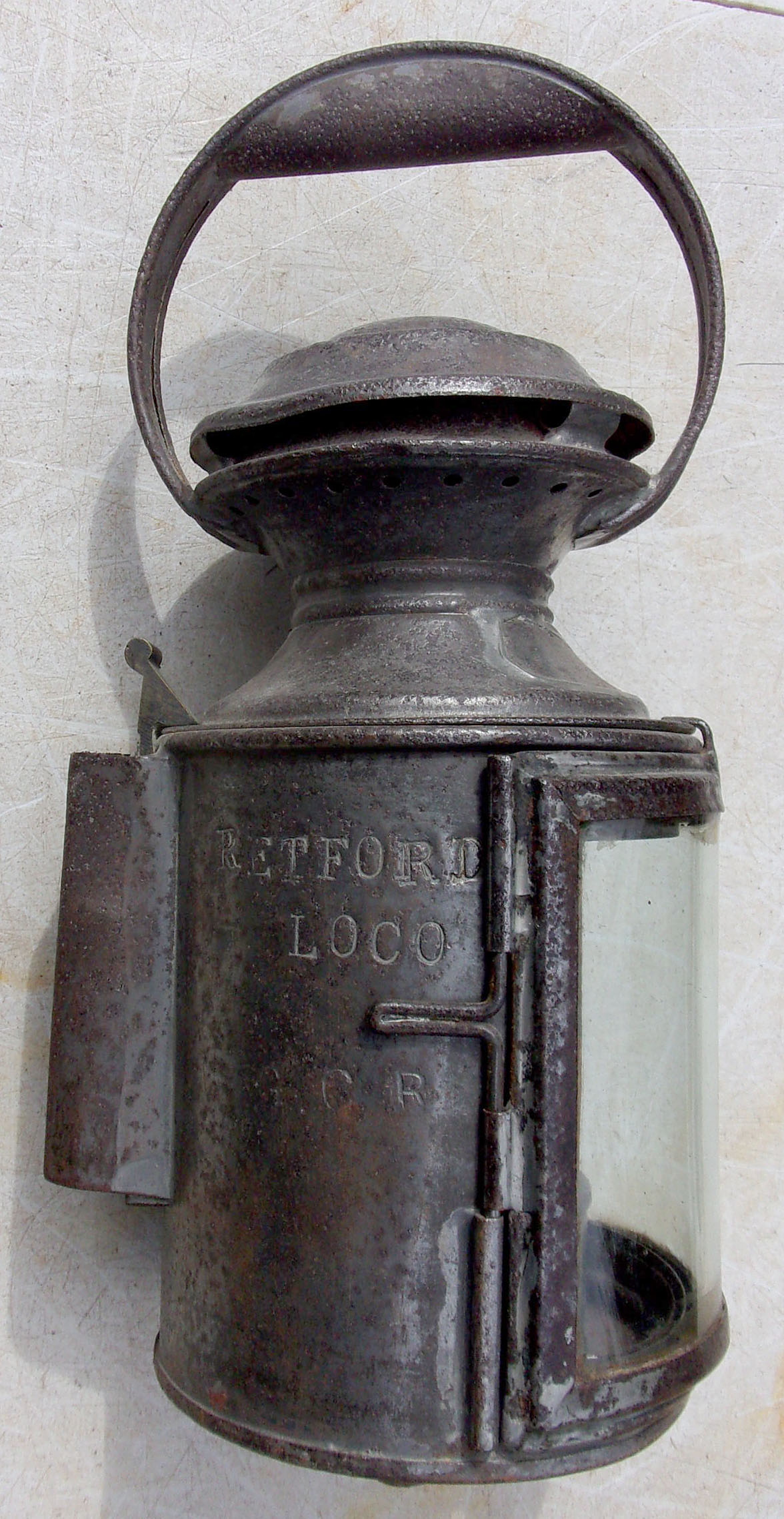 GCR Loco Drivers Handlamp, 3 aspect, body stamped "Retford Loco G.C.R." complete with all glasses and GCR stamped vessel. Rare lamp.