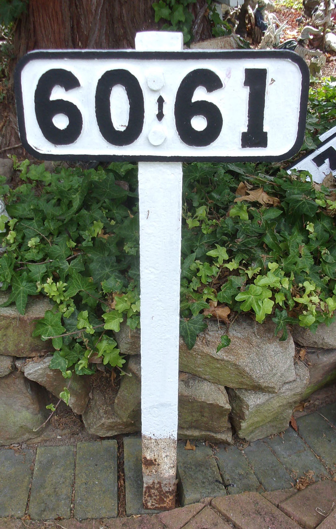 L&NWR cast iron Cottage Numbers from Crewe adjacent to the old Chester Line that lead into the works. Bolted to original wrought iron post, twin occupancy dwellings. Sound, repainted.