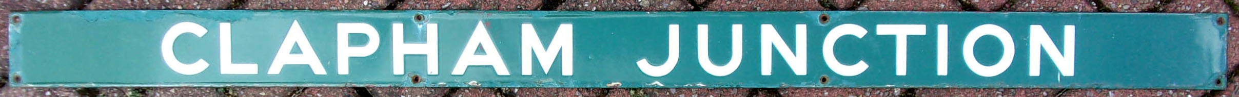 Enamel Southern Railway Seatback "Clapham Junction". Good colour & shine. 48" x 3".