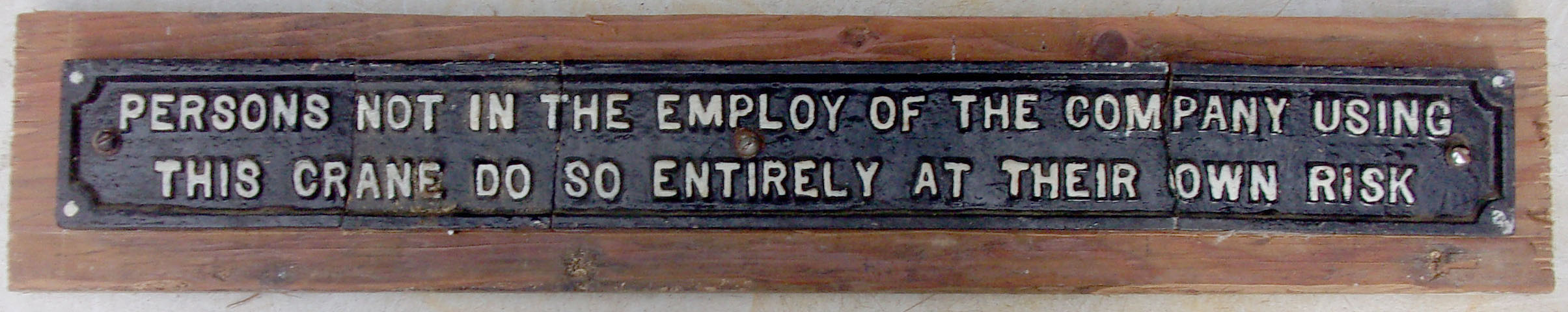 Cast iron Crane Plate preserved on board as it is broken in four pieces 22"x 2.5".