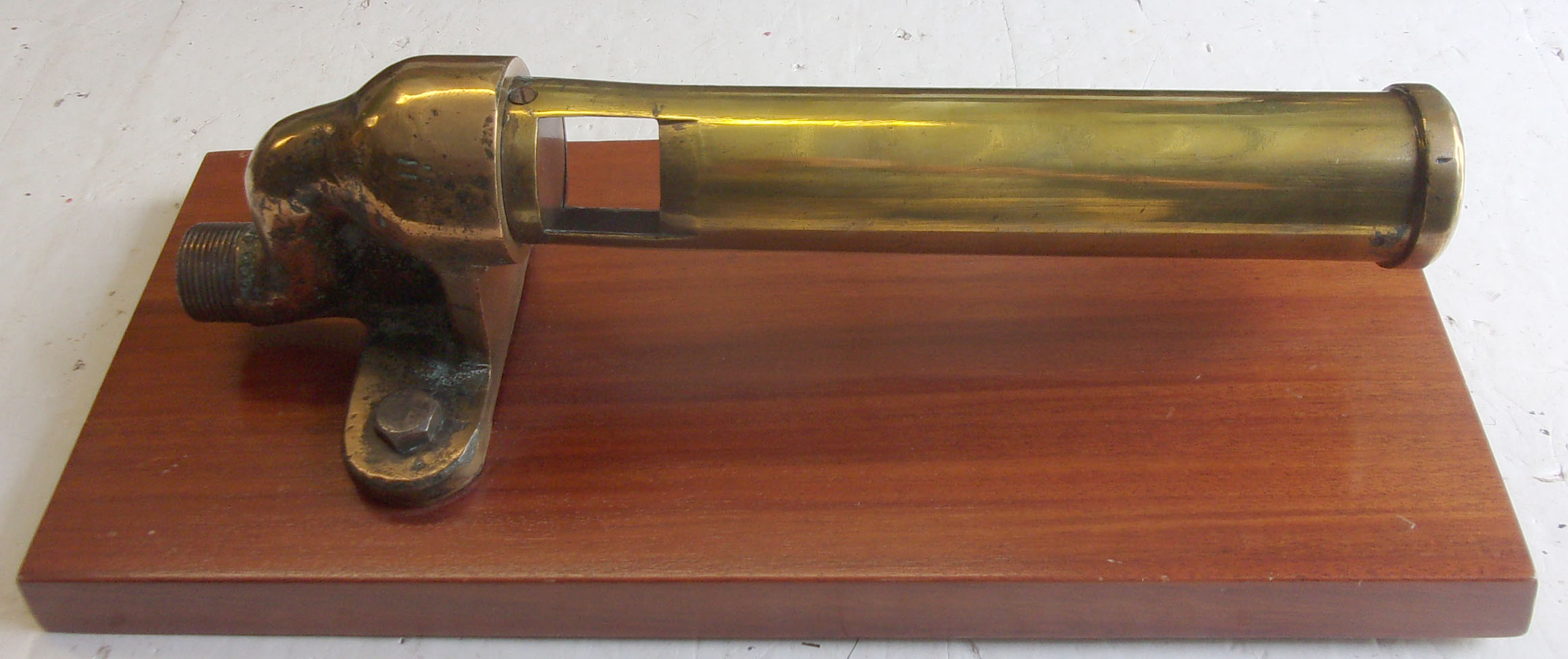 Steamline Coronation Locomotive Hooter. This type of LMS hooter with the swan neck fitting, so modified to clear the streamline caseing on the top of the firebox. A rare item, as there was only 25 Streamline Coronations. Displayed on a polished wooden plinth. Lightly polished brass. In excellent condition.