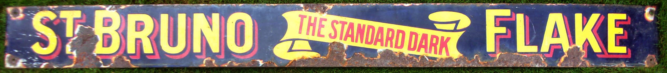Advertising enamel sign "ST BRUNO FLAKE". A famous pipe tobacco. Good colour & shine, some loss of enamel. 57" x 5".
