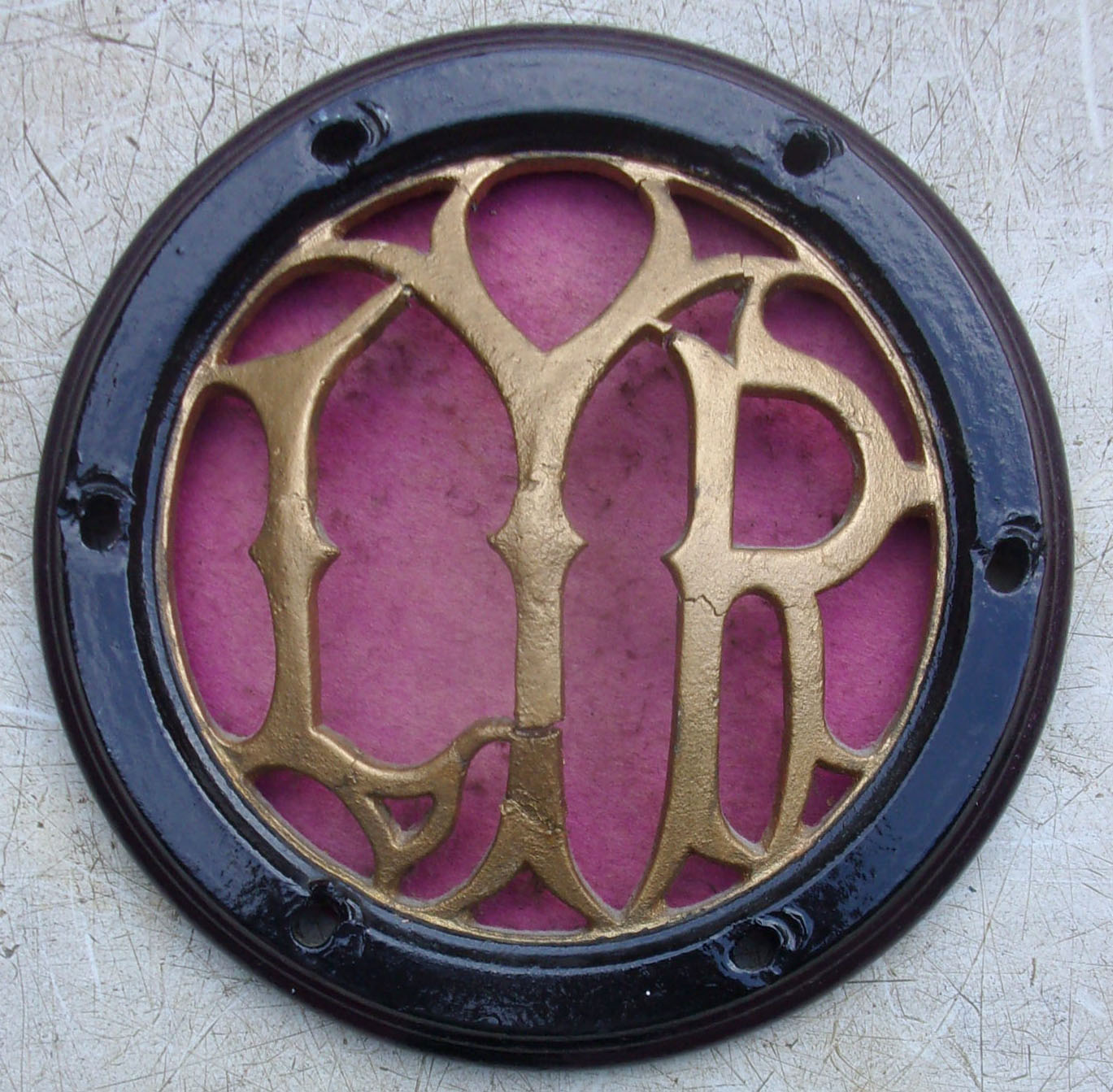 L&Y Ry Carriage Ventilator Cover, cast iron fret work, small crack to letter 'Y' does not detract. 7 1/4" diameter. Nice attractive item.