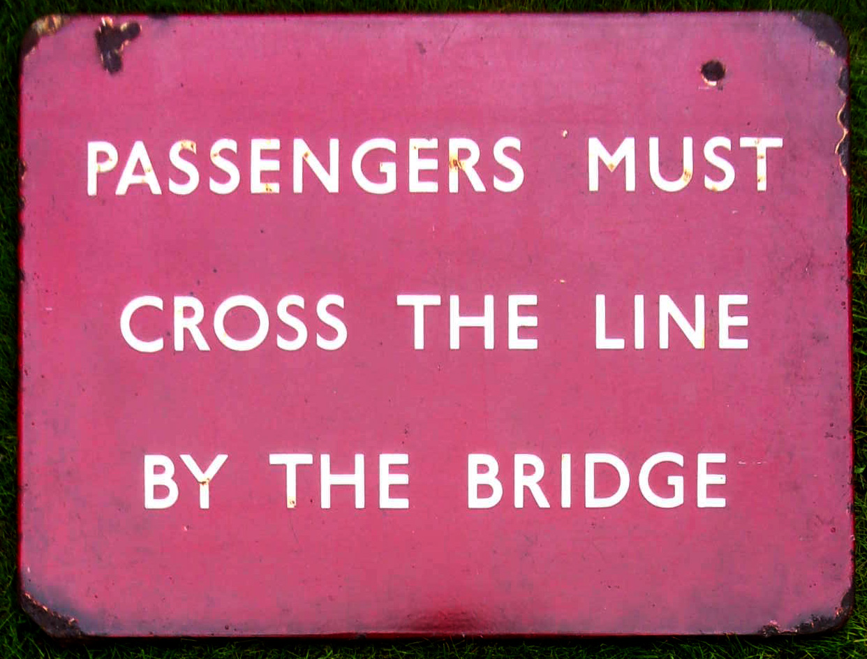 Enamel Sign "PASSENGERS MUST CROSS THE LINE BY THE BRIDGE". BR(M) FF. Good colour & shine 24" x 18".