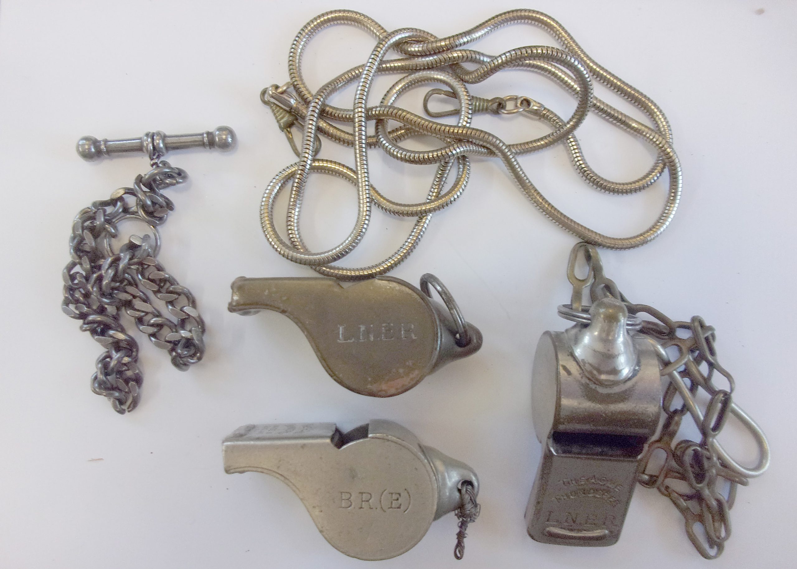 3 x Guards Whistles, Acme Thunderer, 2 x marked LNER, 1 x BR(E) complete with chains. V.g.c.